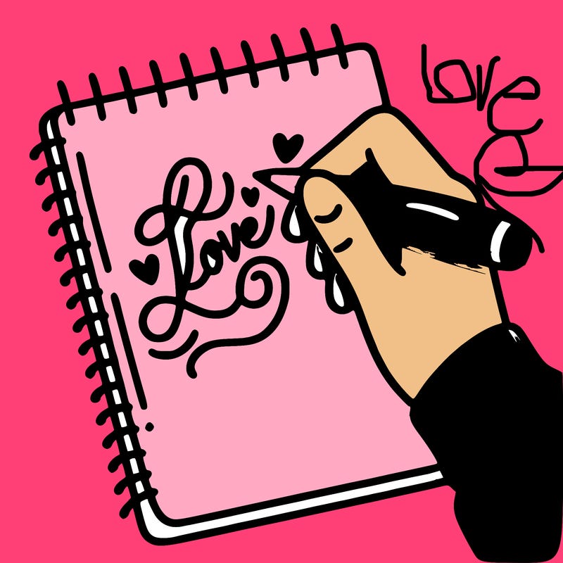 a hand writing “love” in calligraphy on a notebook