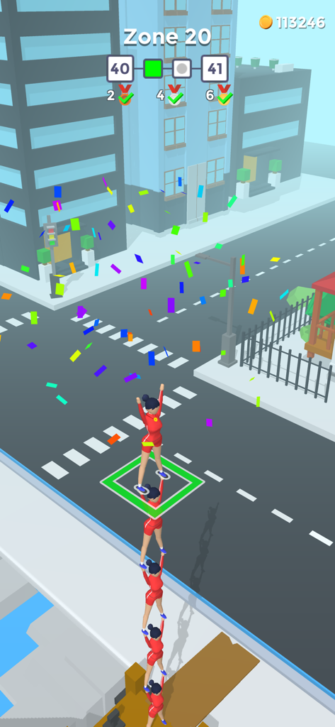 Flip Jump Stack - A tower of cheerleaders in red outfits stacking on top of each other in a city street level with celebratory confetti