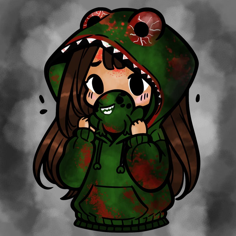 a girl holding a froggy hoodie