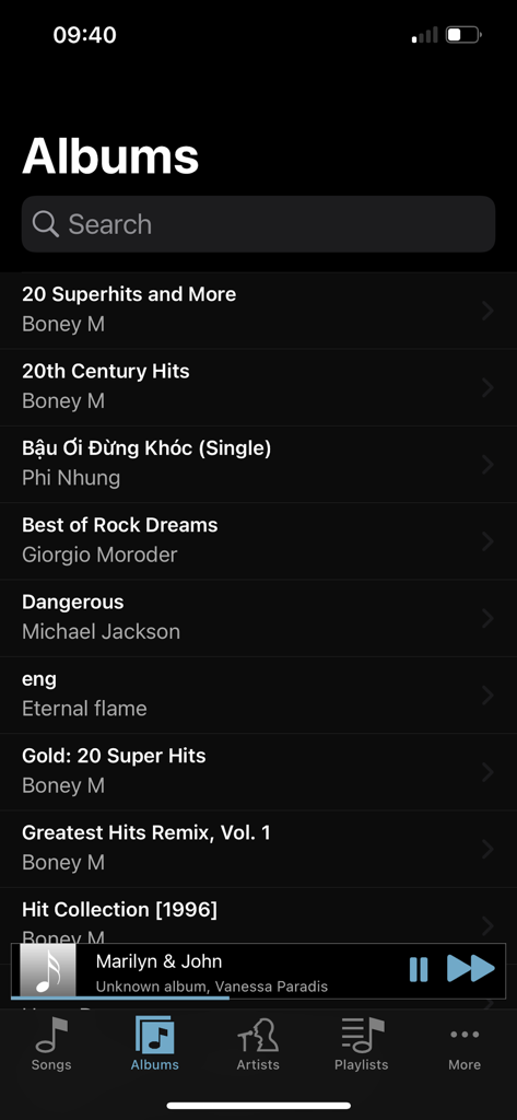 FLAC Player+ - Albums list screen in FLAC Player plus app showing various music collections and a mini player