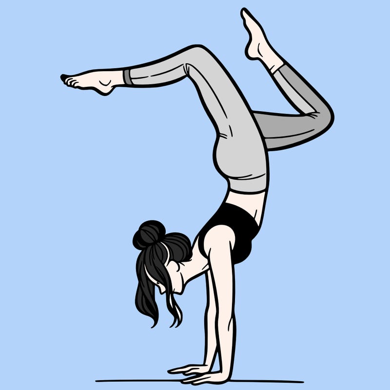 a woman doing a handstand
