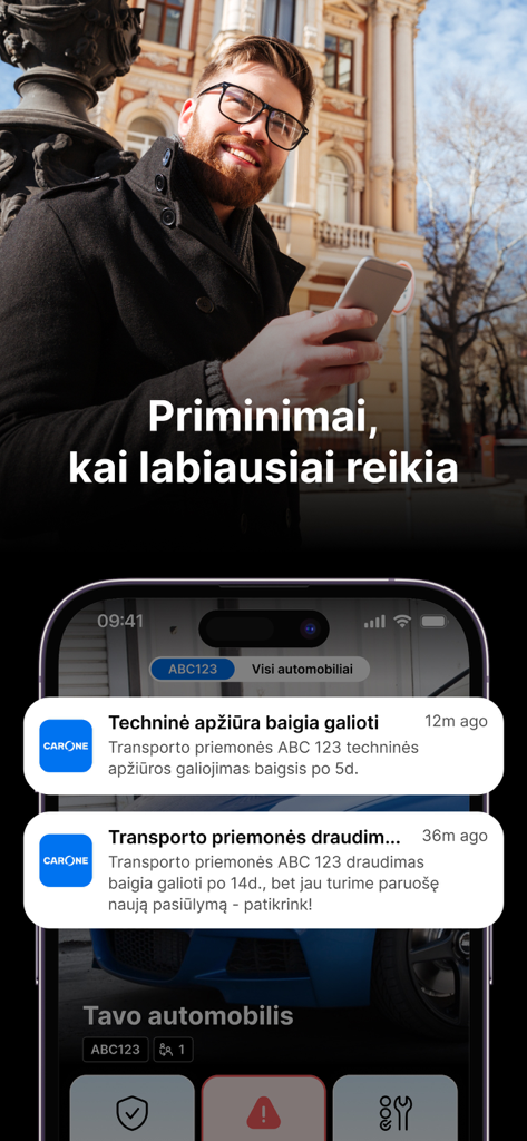 A man looking at his smartphone with carOne app push notifications for car insurance and technical inspection expiration reminders