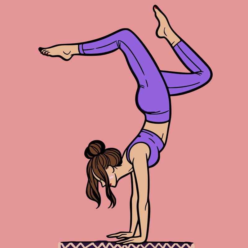 a woman doing a handstand