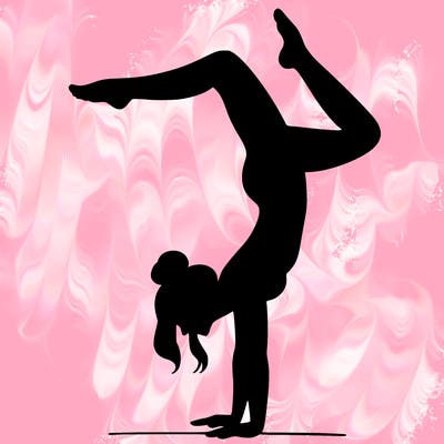a woman doing a handstand