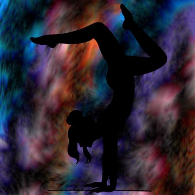 a woman doing a handstand