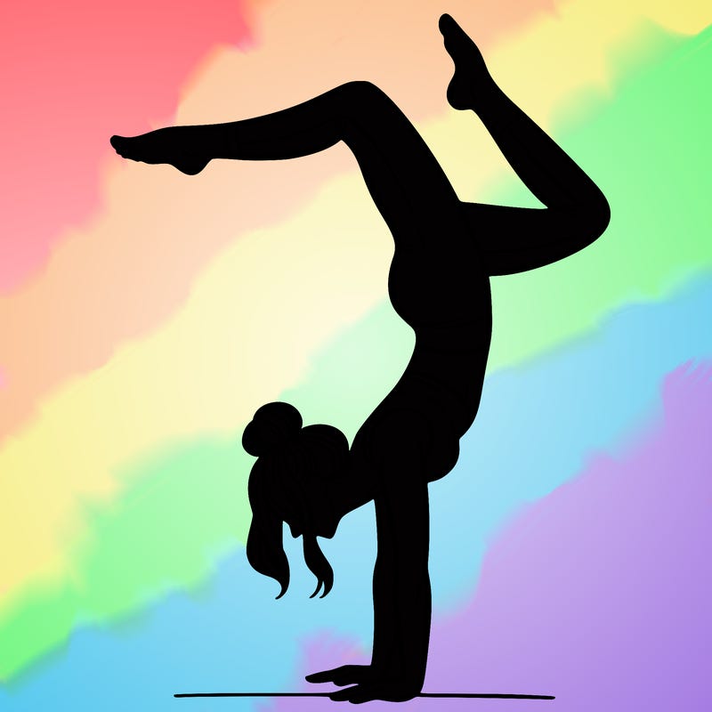 a woman doing a handstand