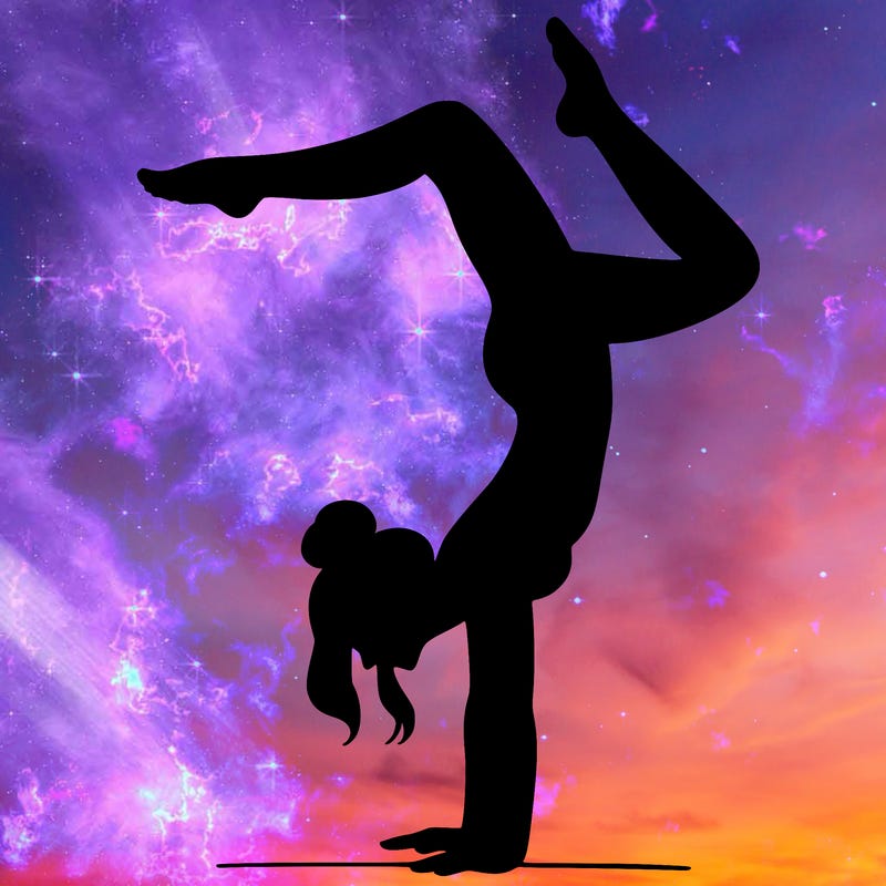 a woman doing a handstand