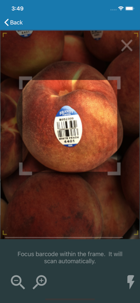 CLAIR + Produce Scanner - Scanning a PLU barcode sticker on a white peach with the CLAIR produce scanner app interface