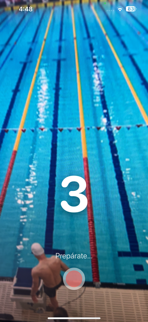 SwimCam - SwimCam app countdown screen with a swimmer on a starting block at a pool