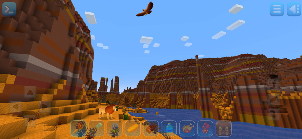 RealmCraft: mine & craft world - Screenshot di gioco di RealmCraft che mostra un canyon desertico di blocchi con un leone e un'aquila in volo