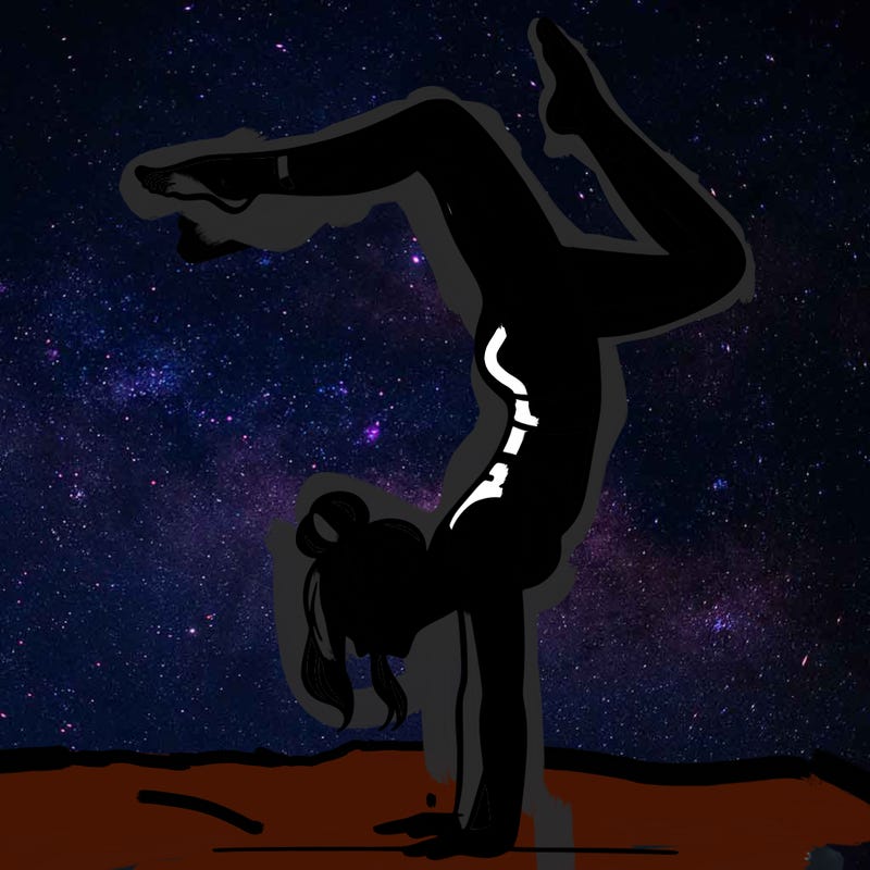 a woman doing a handstand