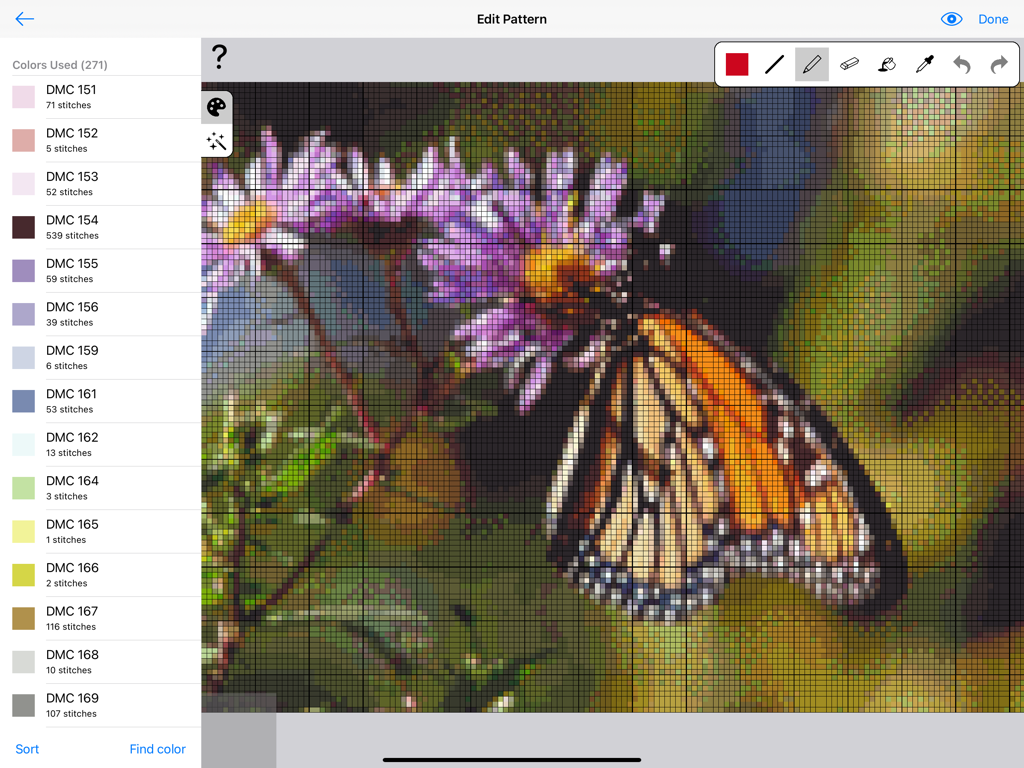 iPad interface of Cross Stitch Creator showing a butterfly pattern being edited with a sidebar listing DMC thread colors.