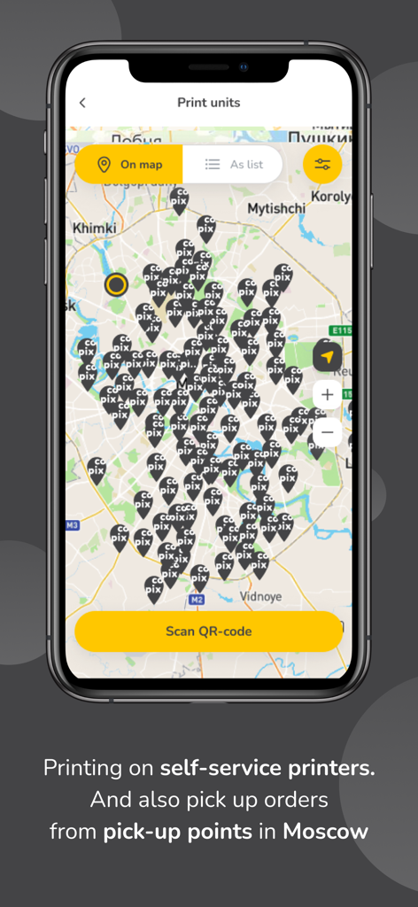 COPIXアプリインターフェース、複数のセルフサービスプリンターアイコンとQRコードスキャンボタンが配置された都市地図を表示