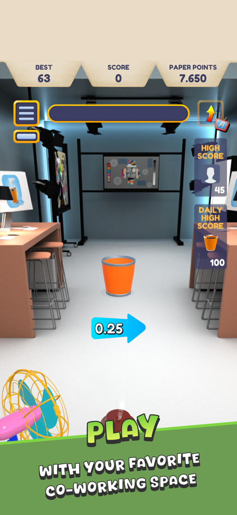 Paper Toss + - Pantalla del juego móvil Paper Toss Plus mostrando un entorno de estudio de oficina con una papelera e indicador de velocidad del viento.