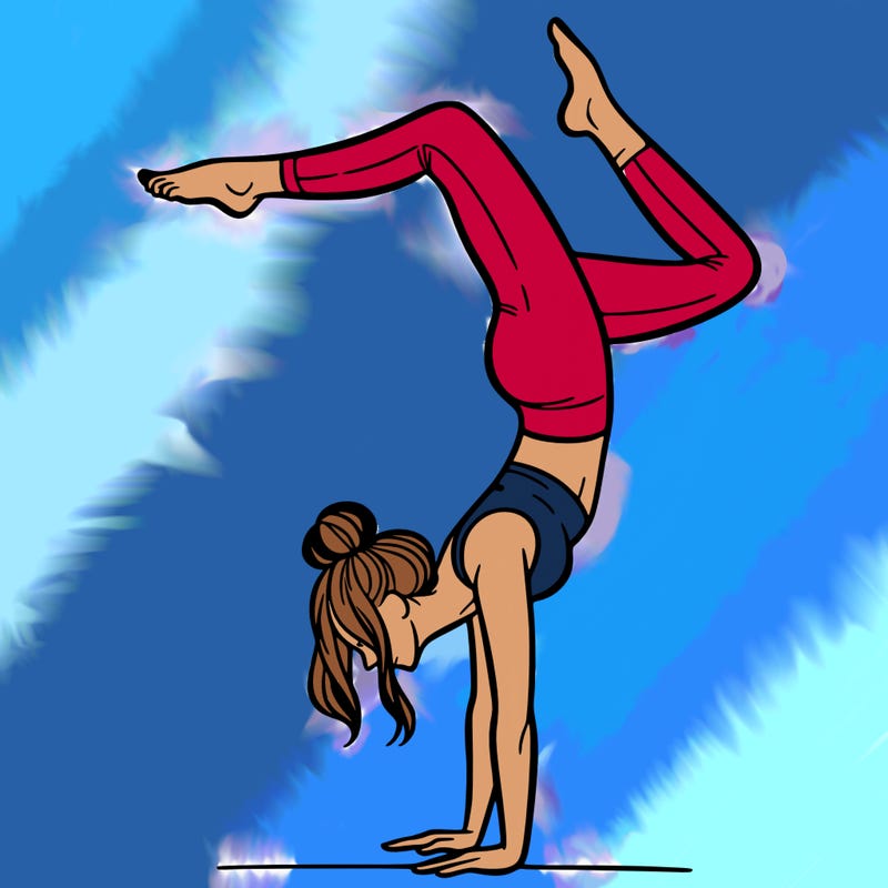 a woman doing a handstand