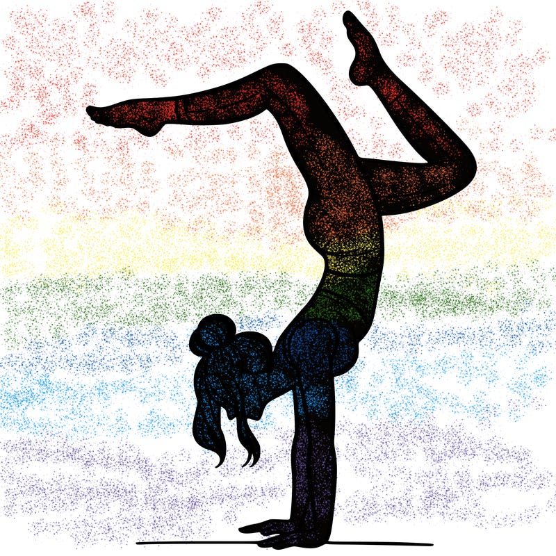 a woman doing a handstand