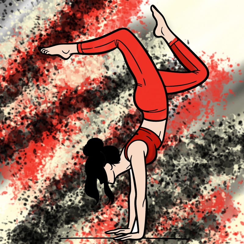 a woman doing a handstand