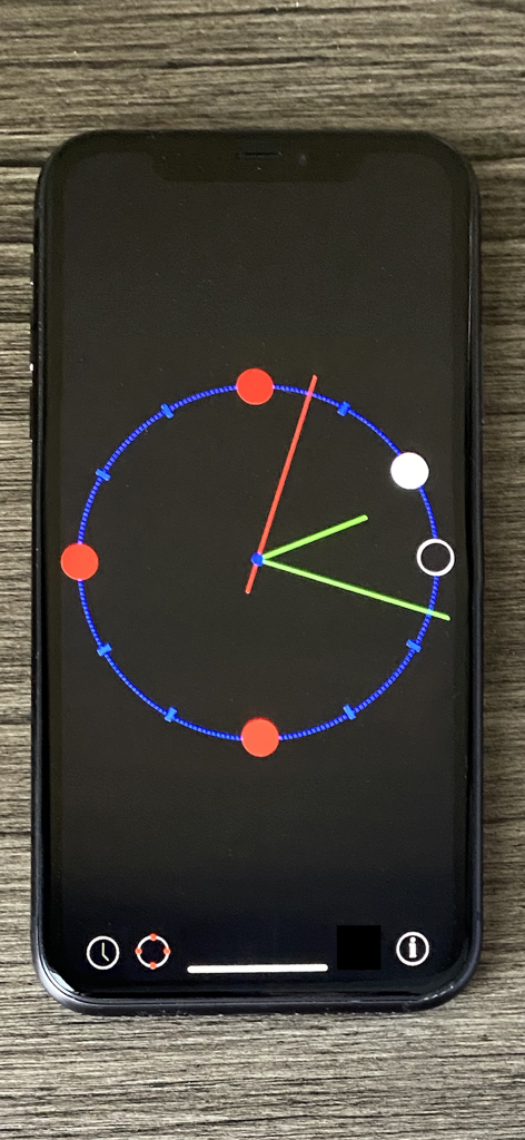Spot o'clock - O aplicativo Spot o clock no iPhone exibindo um mostrador de relógio minimalista com grandes pontos coloridos para reconhecimento de padrões