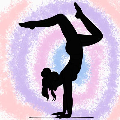 a woman doing a handstand