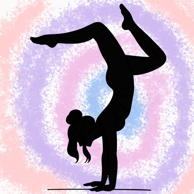 a woman doing a handstand