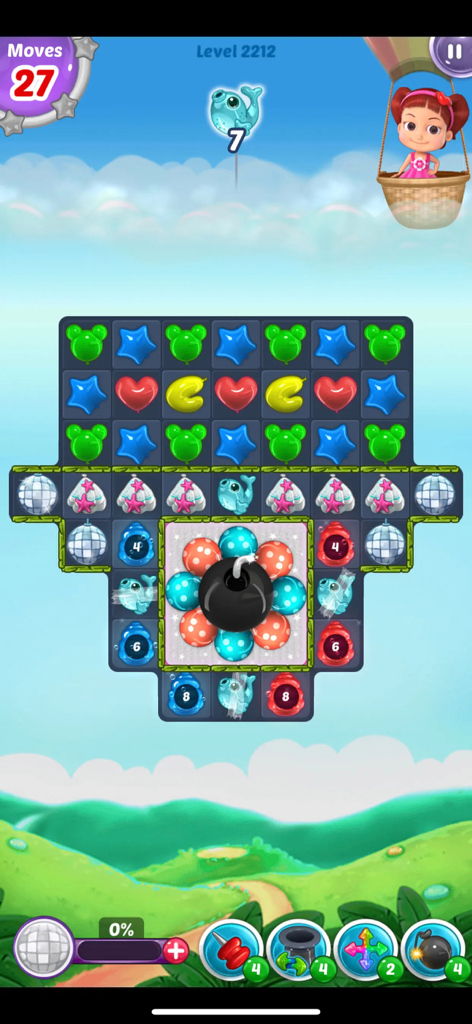 Gameplay screenshot of Balloon Paradise Match 3 Game featuring colorful balloons and a central bomb power up