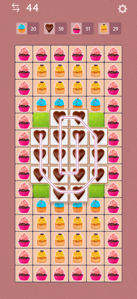 Tile Link - Match & Connect - A screenshot of Tile Link Match and Connect game showing a board filled with colorful cupcake tiles and a glowing line connecting chocolate heart tiles
