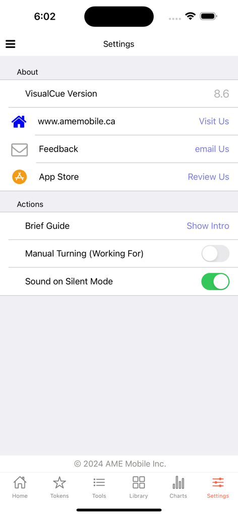Visual Cue - Settings screen of the Visual Cue app showing configuration options for behavioral tools and developer contact information.