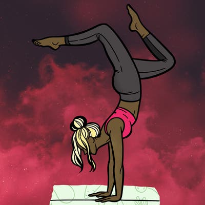 a woman doing a handstand