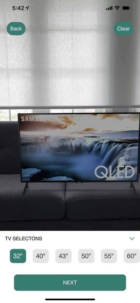 TVfit app screen showing a virtual TV placed in a room with size selection options