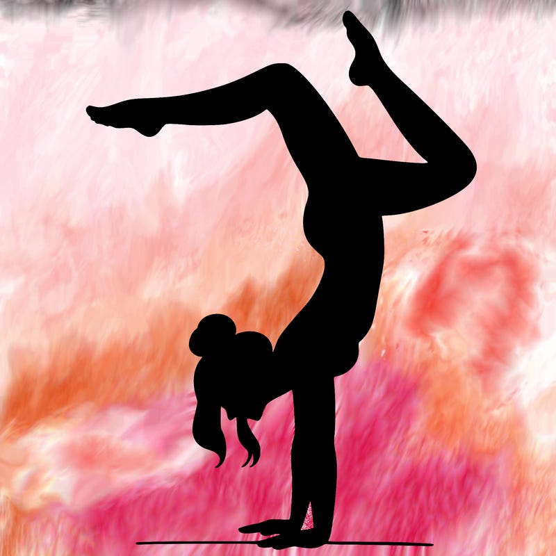 a woman doing a handstand