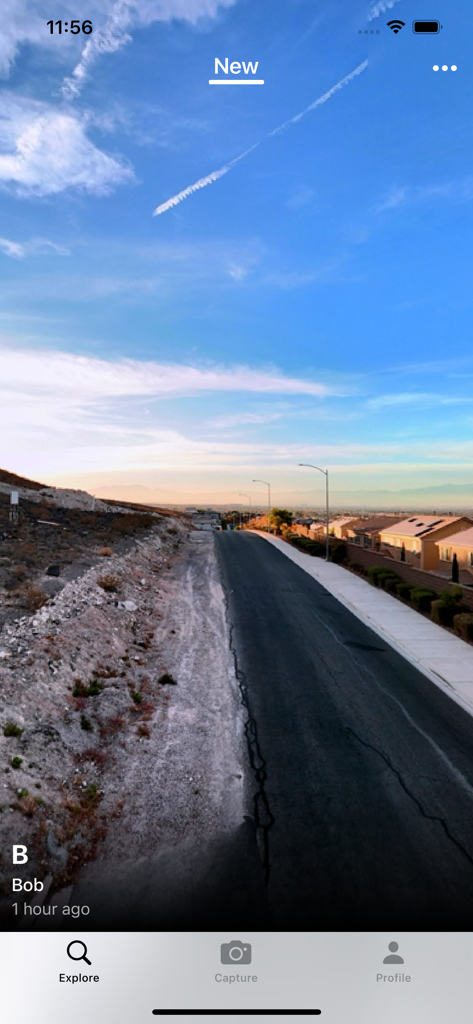 Teleport app explore screen showing a panoramic photo of a suburban street under a blue sky