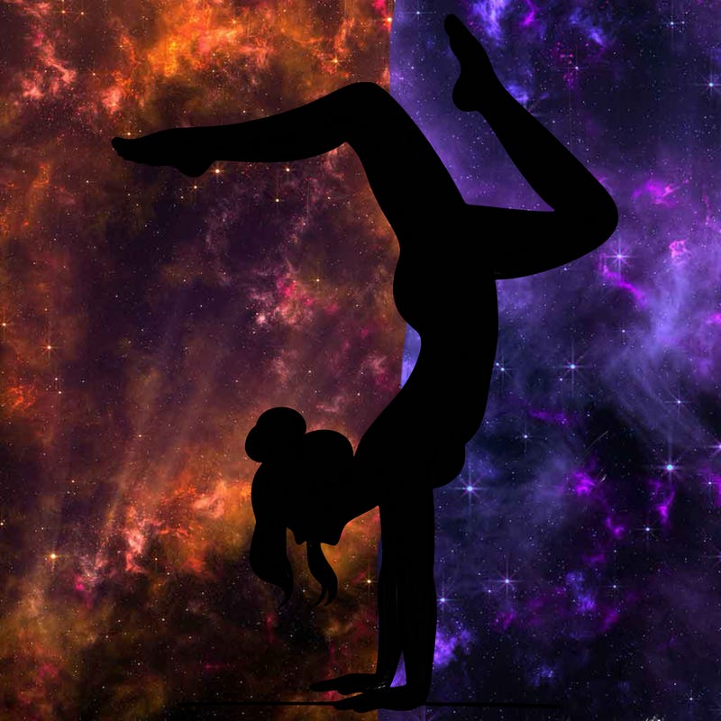 a woman doing a handstand