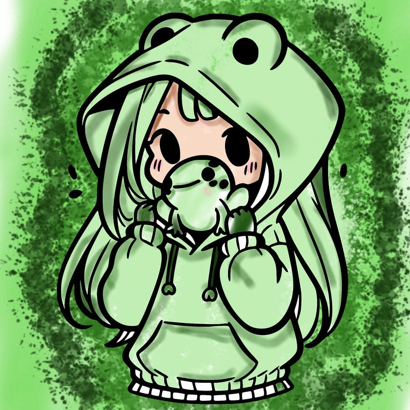 a girl holding a froggy hoodie