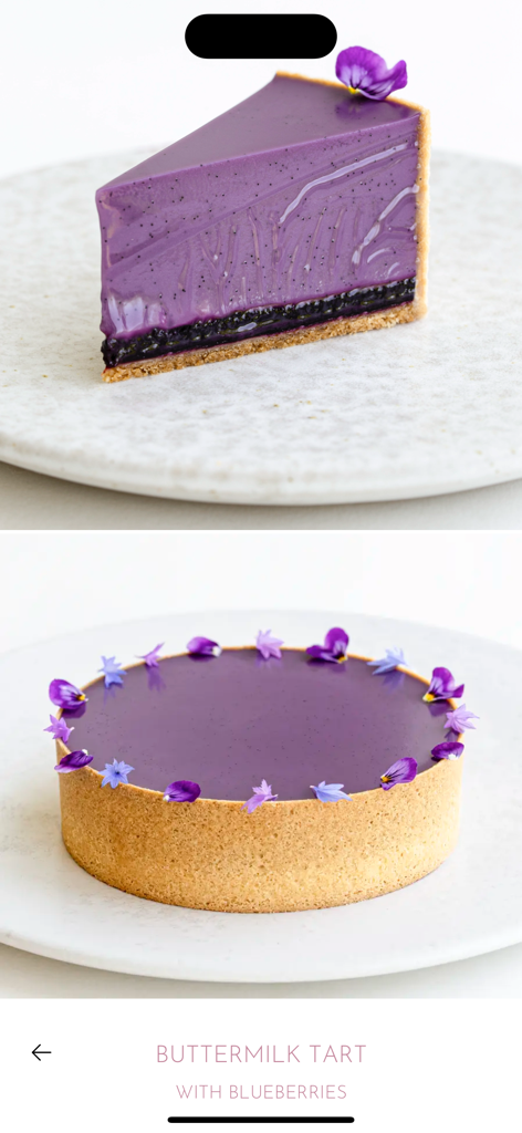 A beautiful purple buttermilk tart with blueberries decorated with edible flowers from the Maja Vase app.