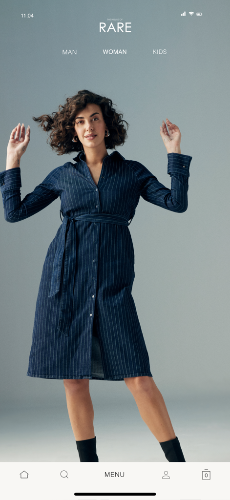 HOUSE OF RARE - A woman modeling a navy pinstriped dress in the House of Rare mobile app