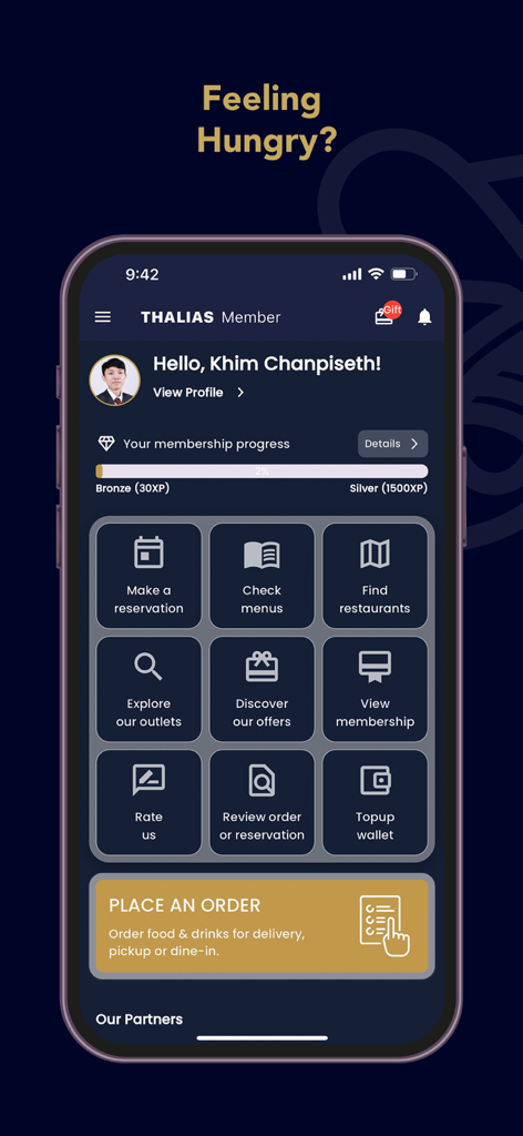 Thalias - The home screen of the Thalias app displaying dining reservation and membership loyalty features on a mobile device