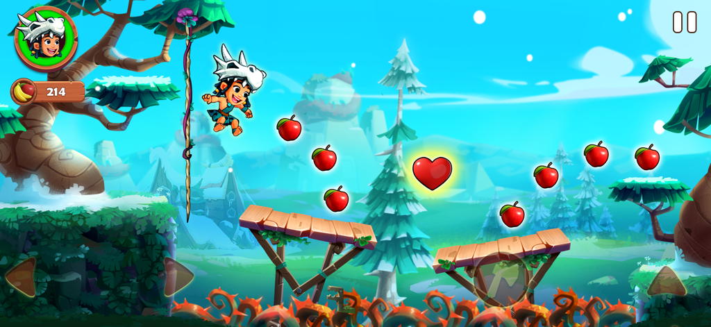 Jungle Adventures 4 - Addu jumping to collect apples and a heart in a colorful jungle platformer level