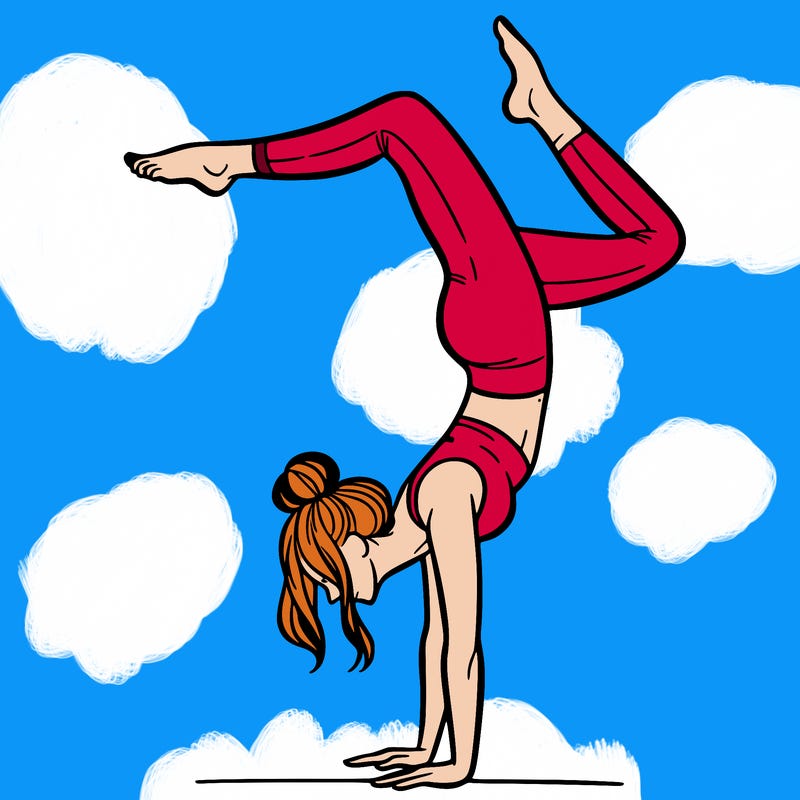 a woman doing a handstand