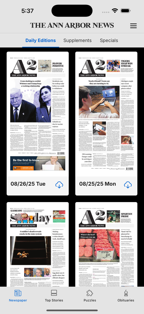 A mobile interface of The Ann Arbor News app showing a digital archive of daily newspaper editions with options for supplements and specials