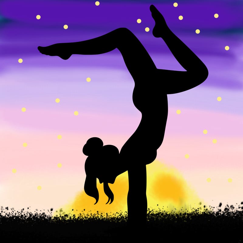 a woman doing a handstand