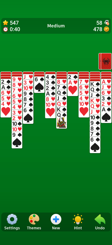 Spider Solitaire` - Spider Solitaire game interface showing a medium difficulty card deal on a classic green background