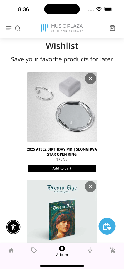 Pantalla de lista de deseos en la aplicación Music Plaza mostrando merchandising de K-pop que incluye un anillo abierto de estrella de Seonghwa de ATEEZ.