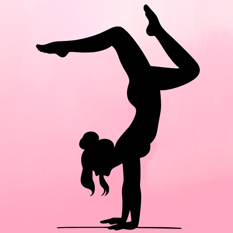 a woman doing a handstand
