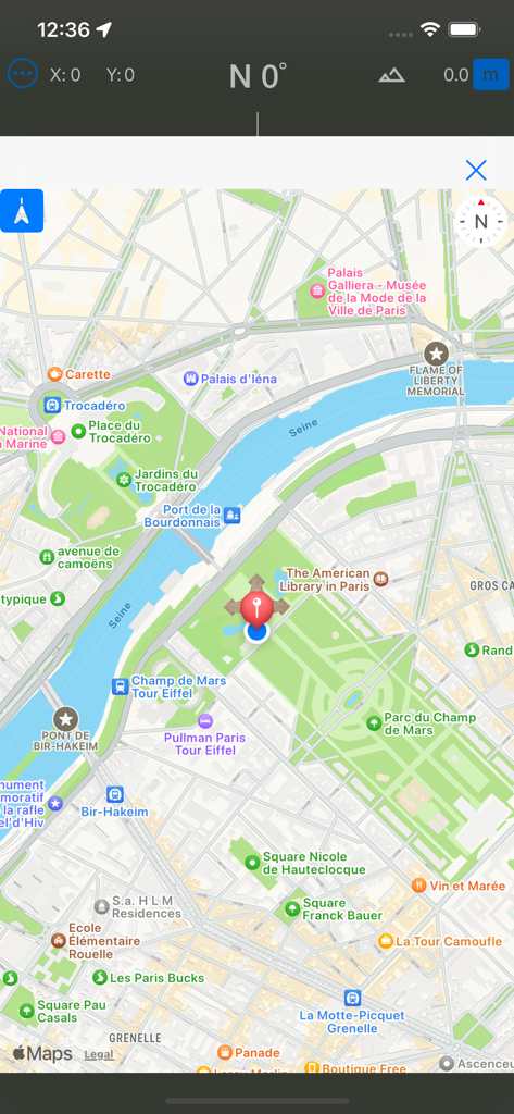 Map view of the Compass and GPS app showing a location pin in Paris with compass orientation data at the top