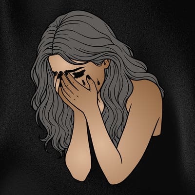 girl with beautiful hair who is crying with her head in her hands
