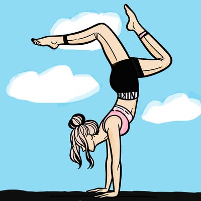 a woman doing a handstand
