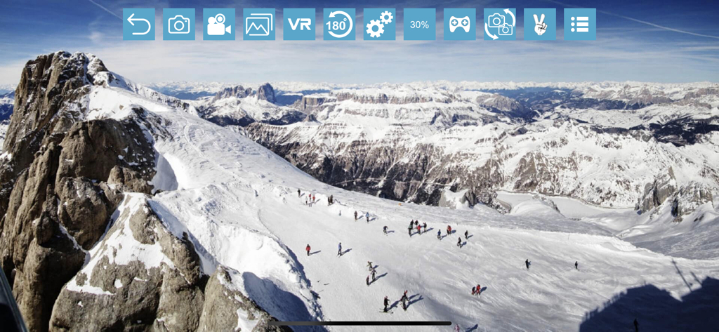 RCFPVPro - Aerial FPV view of snowy mountains and skiers from a drone camera interface