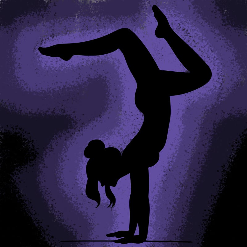 a woman doing a handstand