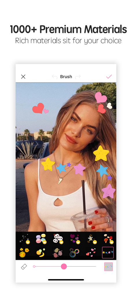 A woman portrait being decorated with colorful heart and star stamps in the Photo Wonder app interface
