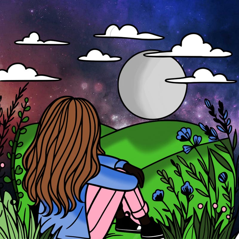 a girl sitting in a sunset